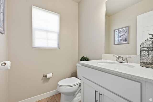 3244 West 1670th Street North Provo, UT 84601 - Photo 23 of 56 Bathroom featuring a white vanity with an integrated sink, quartz-finish countertop, and brushed nickel faucet
