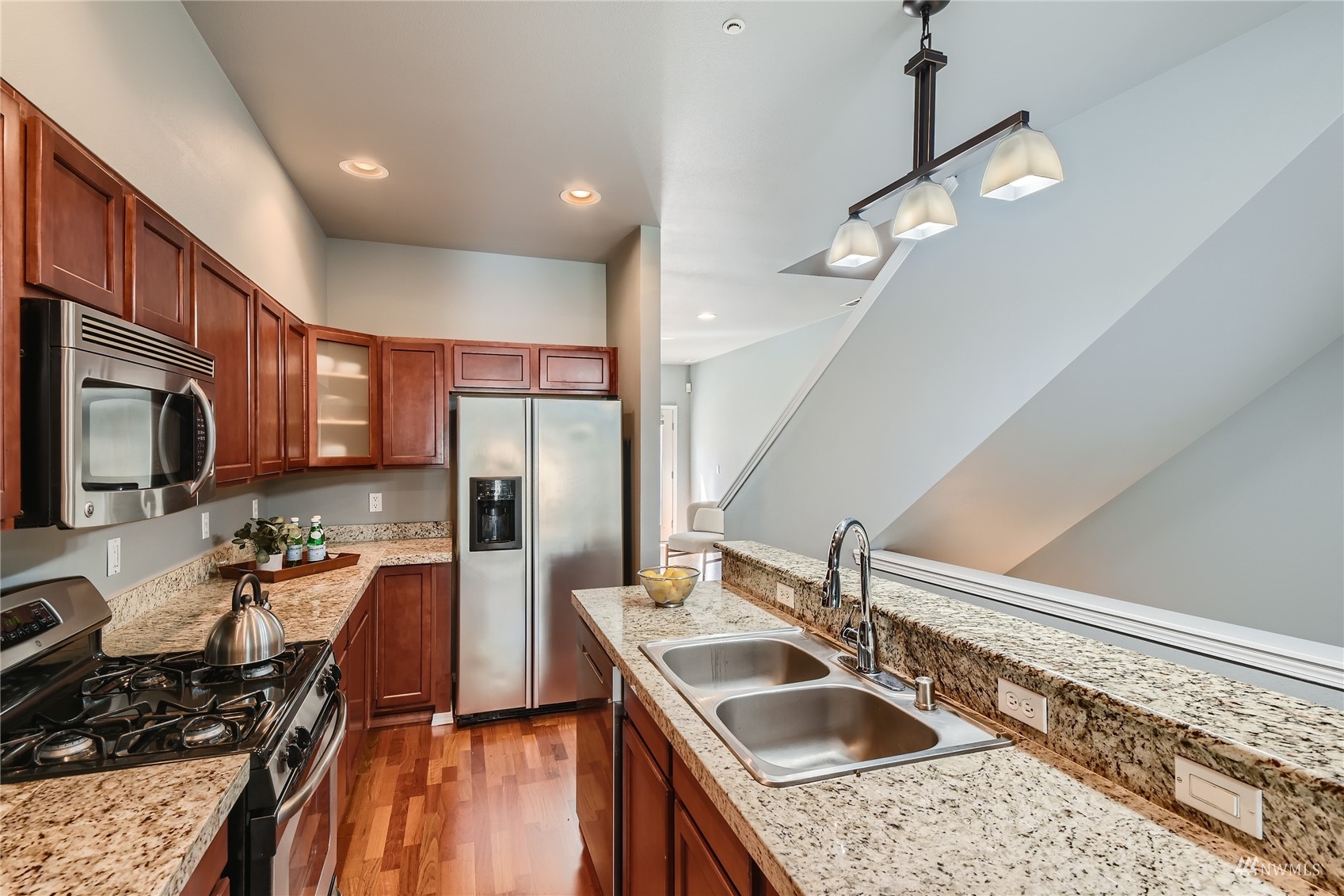 1054 215th Place Southeast Bothell, WA 98021 - Photo 11 of 28 a kitchen with a sink stove and refrigerator