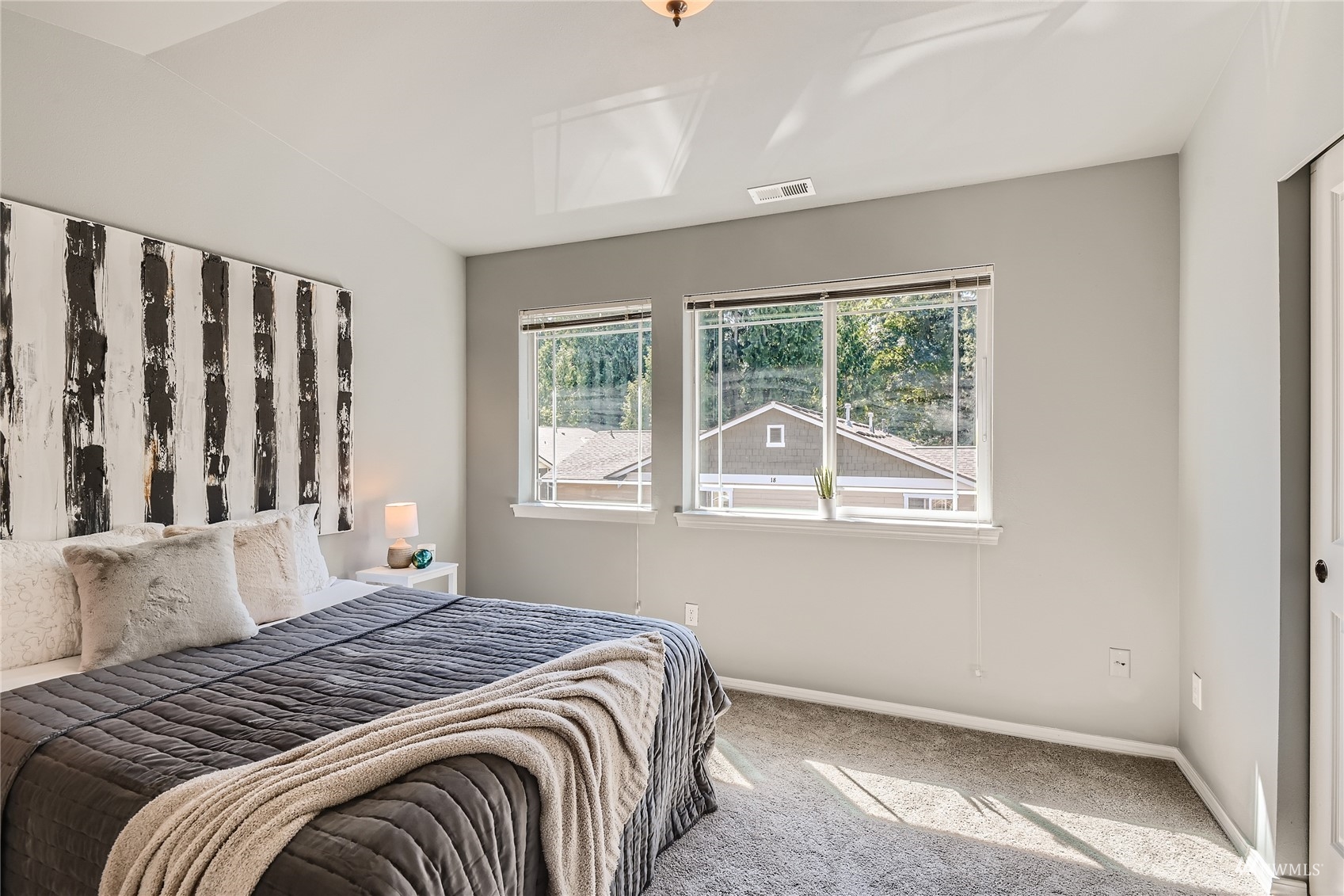 1054 215th Place Southeast Bothell, WA 98021 - Photo 12 of 28 a bedroom with a bed and a window
