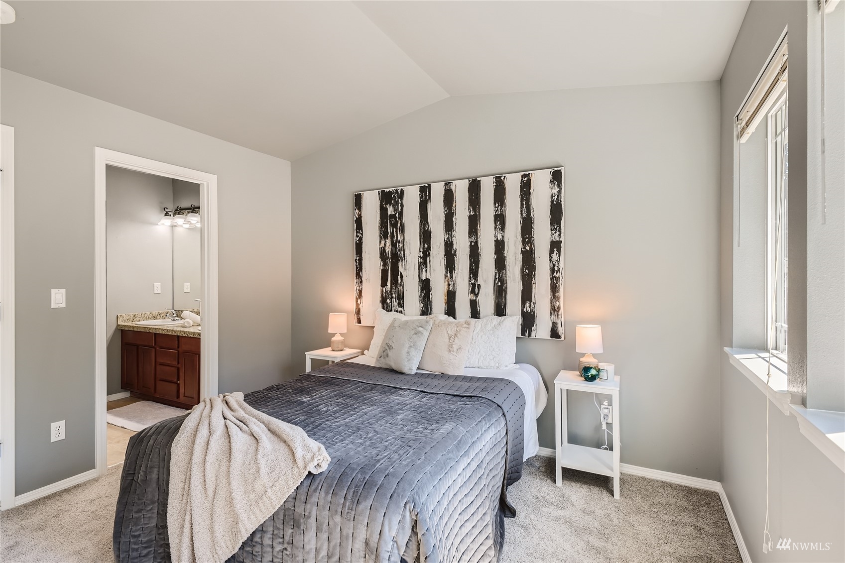 1054 215th Place Southeast Bothell, WA 98021 - Photo 13 of 28 a bedroom with a bed and a window