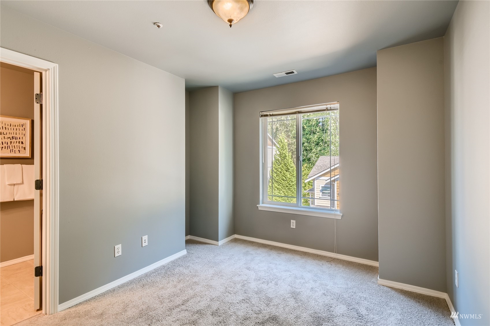 1054 215th Place Southeast Bothell, WA 98021 - Photo 17 of 28 an empty room with windows and closet
