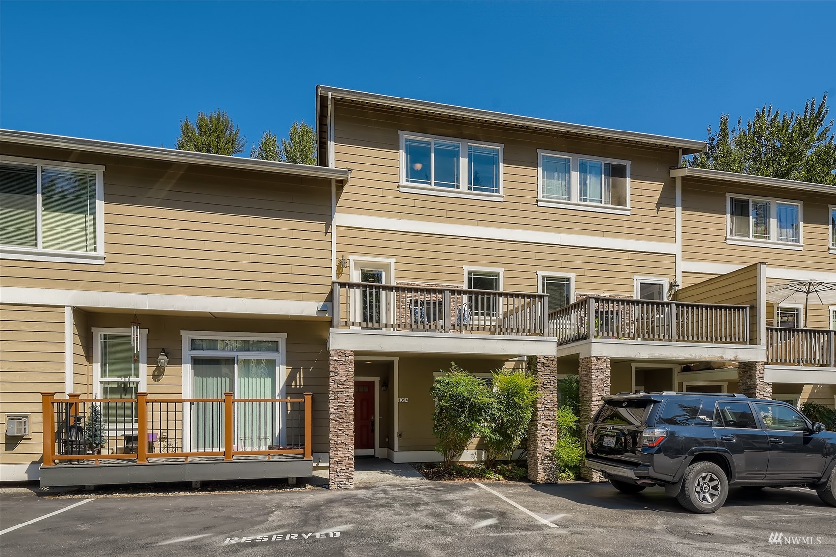 1054 215th Place Southeast Bothell, WA 98021 - Photo 2 of 28 a view of a car park in front of house