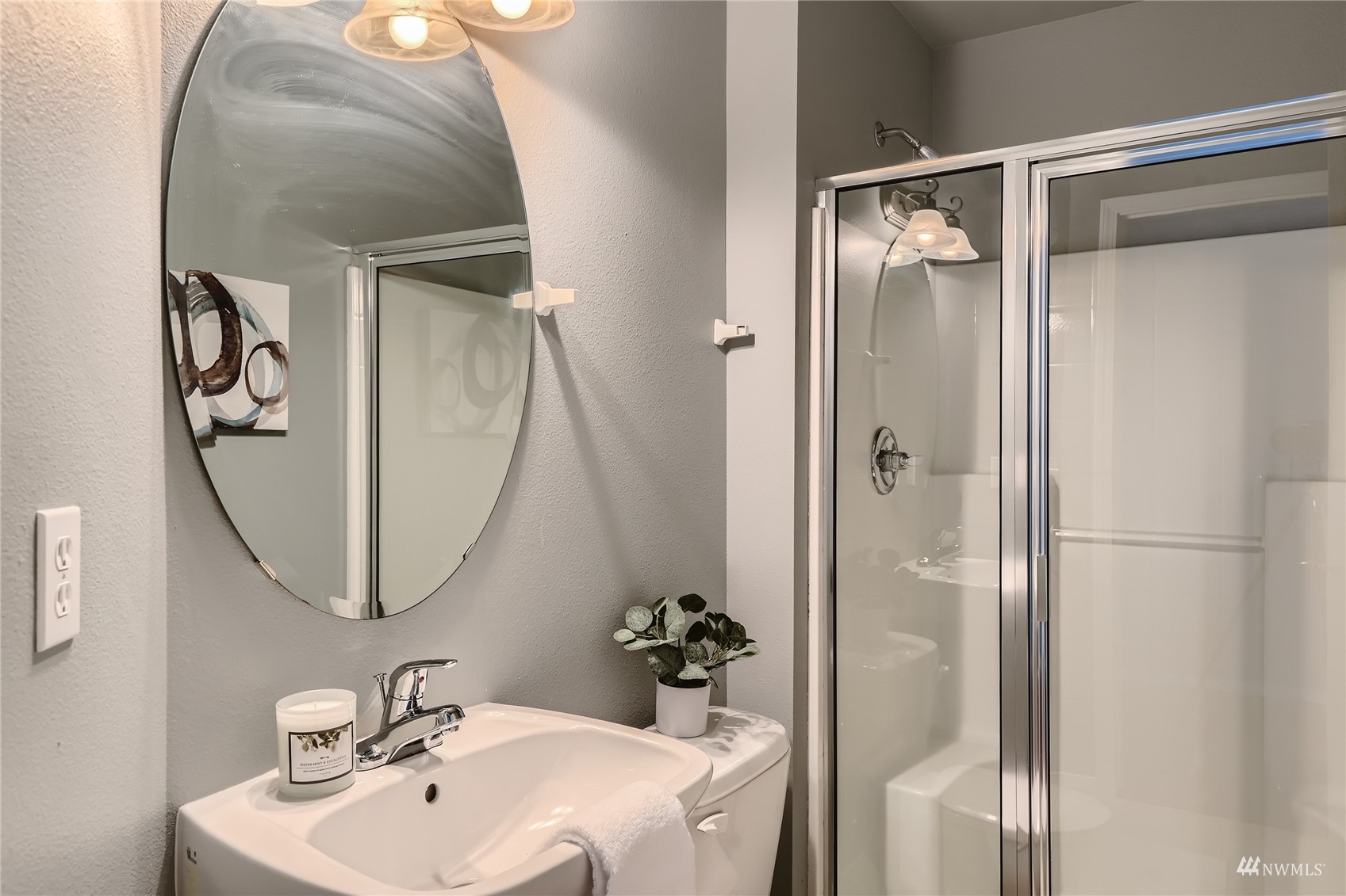 1054 215th Place Southeast Bothell, WA 98021 - Photo 23 of 28 a bathroom with a sink and mirror