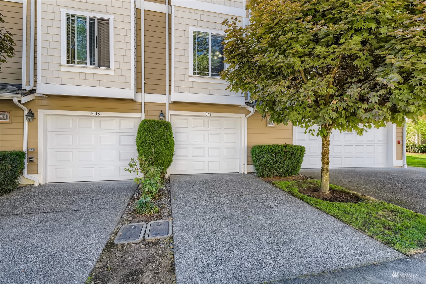 1054 215th Place Southeast Bothell, WA 98021 - Photo 27 of 28 a front view of a house with garden