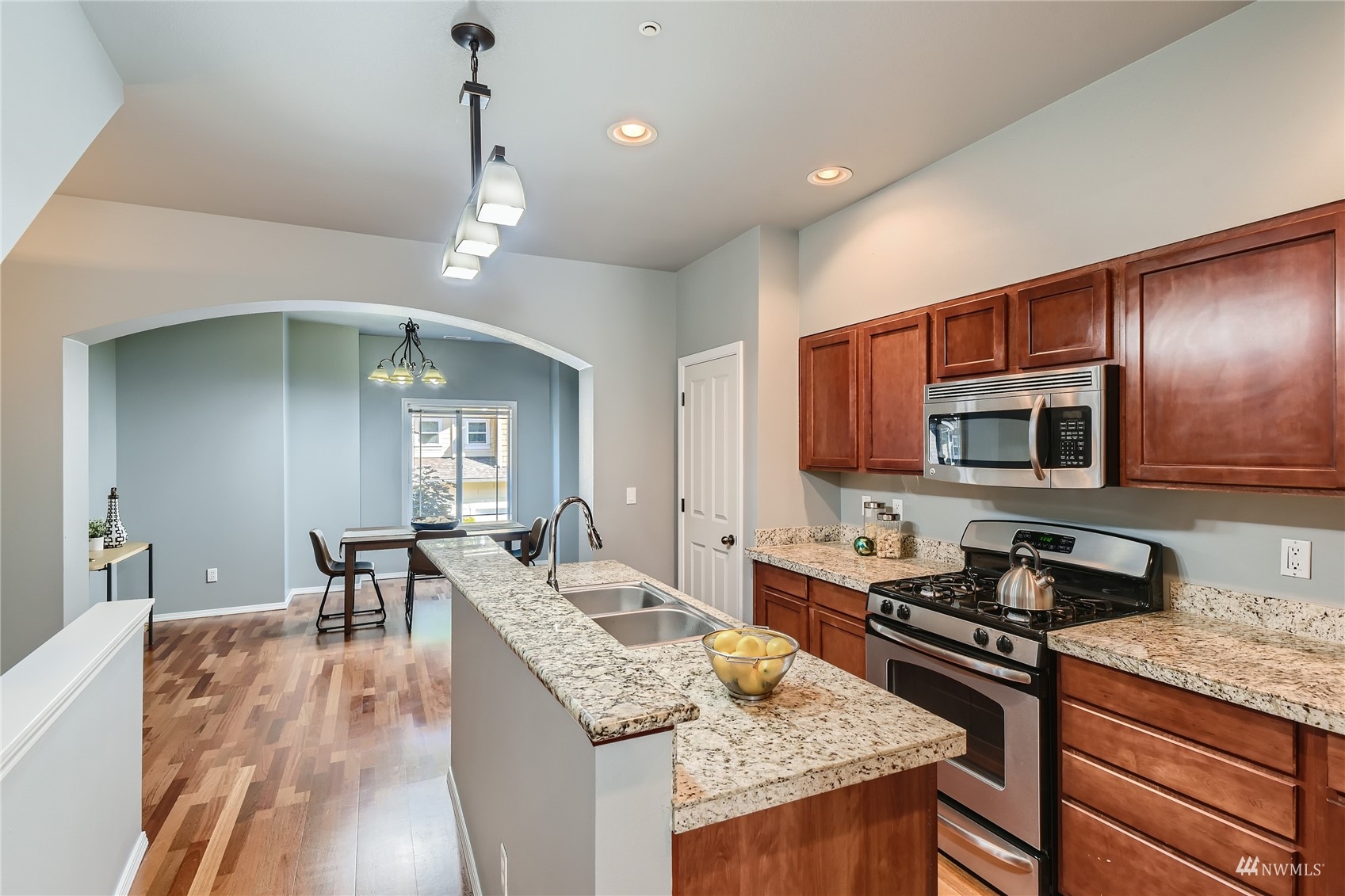 1054 215th Place Southeast Bothell, WA 98021 - Photo 9 of 28 a kitchen with sink stove and cabinets