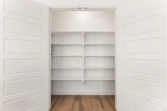 a room with toys and a book shelf