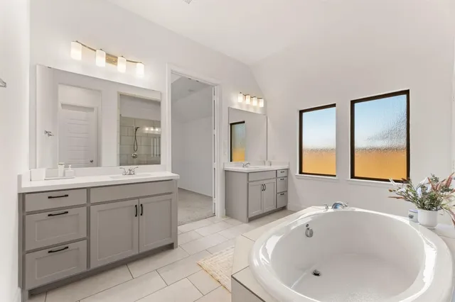 an empty room with chandelier fan