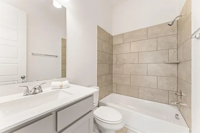 a bathroom with a sink vanity and a mirror