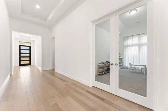 wooden floor in a hall with a window
