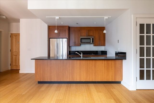 $885,000 | 21 Father Francis Gilday Street, Unit 301, Boston, MA 02118