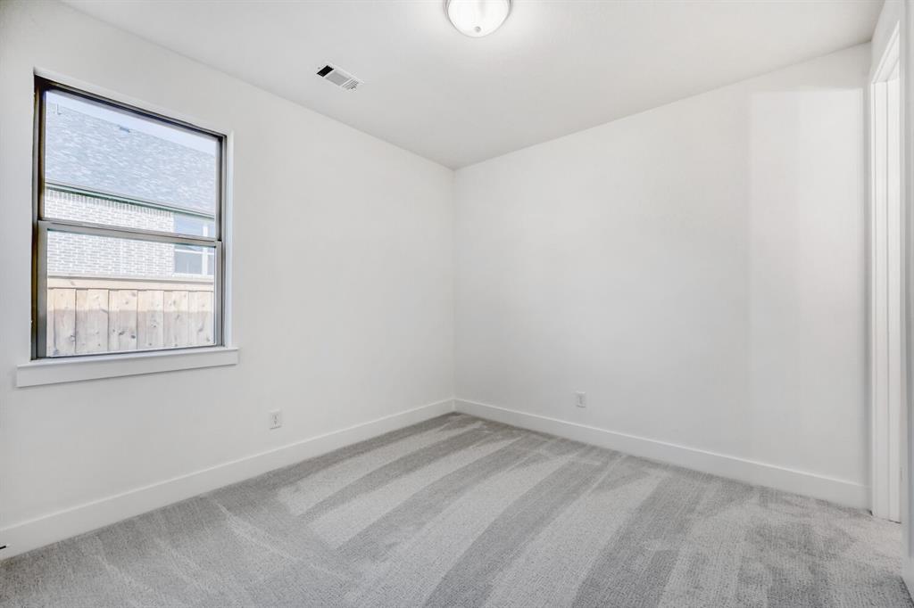 180 Buffalo Boulevard Rhome, TX 76078 - Photo 15 of 28 an empty room with a window