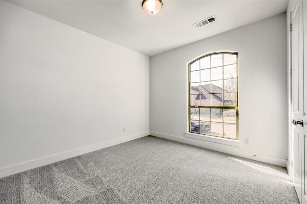 180 Buffalo Boulevard Rhome, TX 76078 - Photo 16 of 28 an empty room with windows and closet