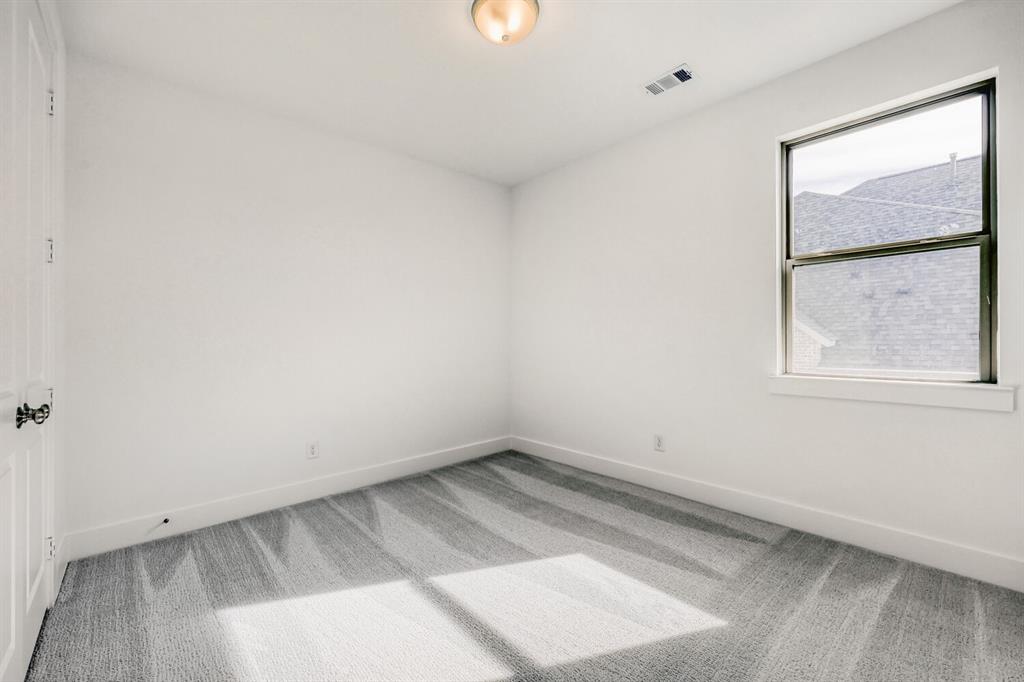 180 Buffalo Boulevard Rhome, TX 76078 - Photo 18 of 28 an empty room with a window