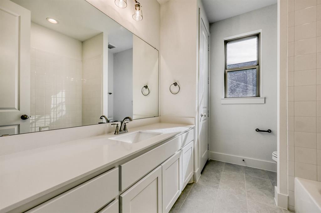 180 Buffalo Boulevard Rhome, TX 76078 - Photo 21 of 28 a bathroom with a sink and a mirror