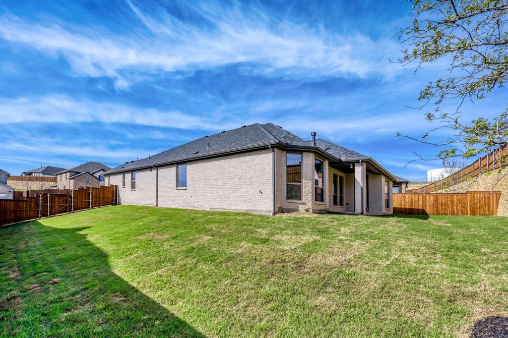 180 Buffalo Boulevard Rhome, TX 76078 - Photo 23 of 28 a big house with a big yard and large trees