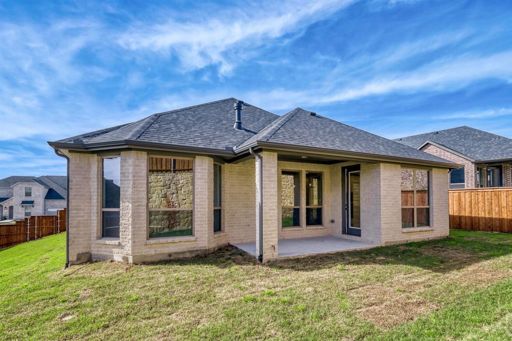 180 Buffalo Boulevard Rhome, TX 76078 - Photo 24 of 28 a view of a house with a backyard