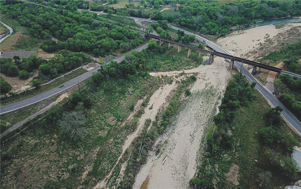 Antonio-austin Post Road San Marcos, TX 78666 - Photo 4 of 5 a view of a yard with a forest