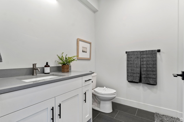 32 West 400 South Bountiful, UT 84010 - Photo 21 of 31 Bathroom with vanity and dark tile patterned flooring Model Home