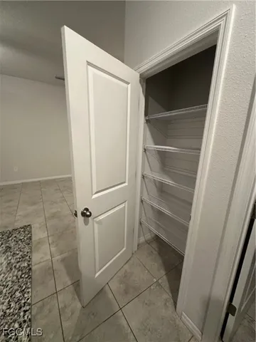 a view of storage and utility room with washer and dryer