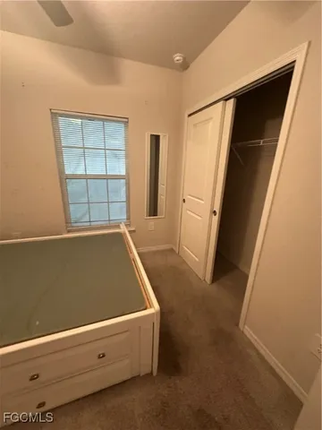 view of room with window and refrigerator