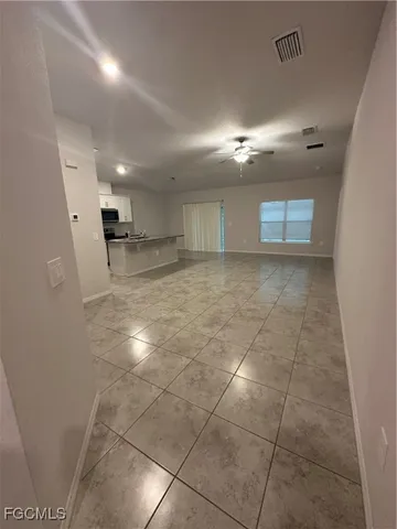 a view of a kitchen with a sink and cabinets