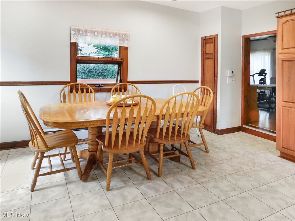 3470 County Line Road Madison, OH 44057 - Photo 38 of 48 Dining space featuring a healthy amount of sunlight and light tile patterned floors