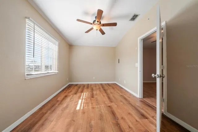 a view of a swimming pool and lounge chairs