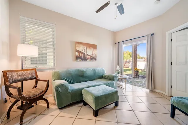 a view of a porch with chairs and backyard