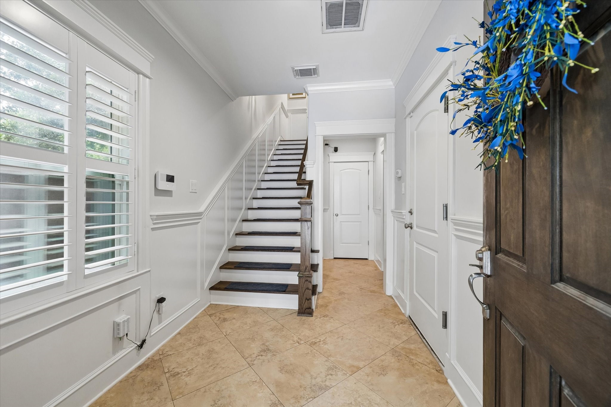 609 Rutland Street, Unit A Houston, TX 77007 - Photo 4 of 30 a view of entryway with paintings on the walls