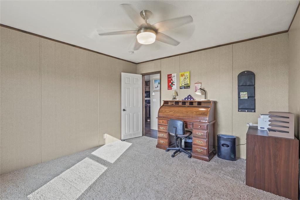 10240 Norrell Road Venus, TX 76084 - Photo 26 of 38 Office space featuring light carpet, crown molding, and a ceiling fan