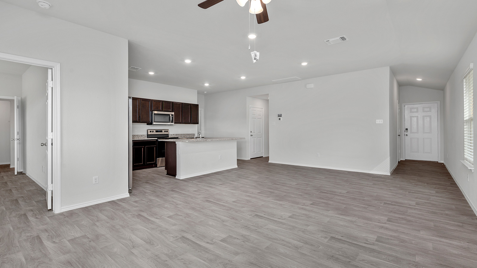 1417 Victory Rnch Trail Killeen, TX 76549 - Photo 7 of 22 An open-concept living space integrates a kitchen with rich cabinetry and an inviting breakfast bar.