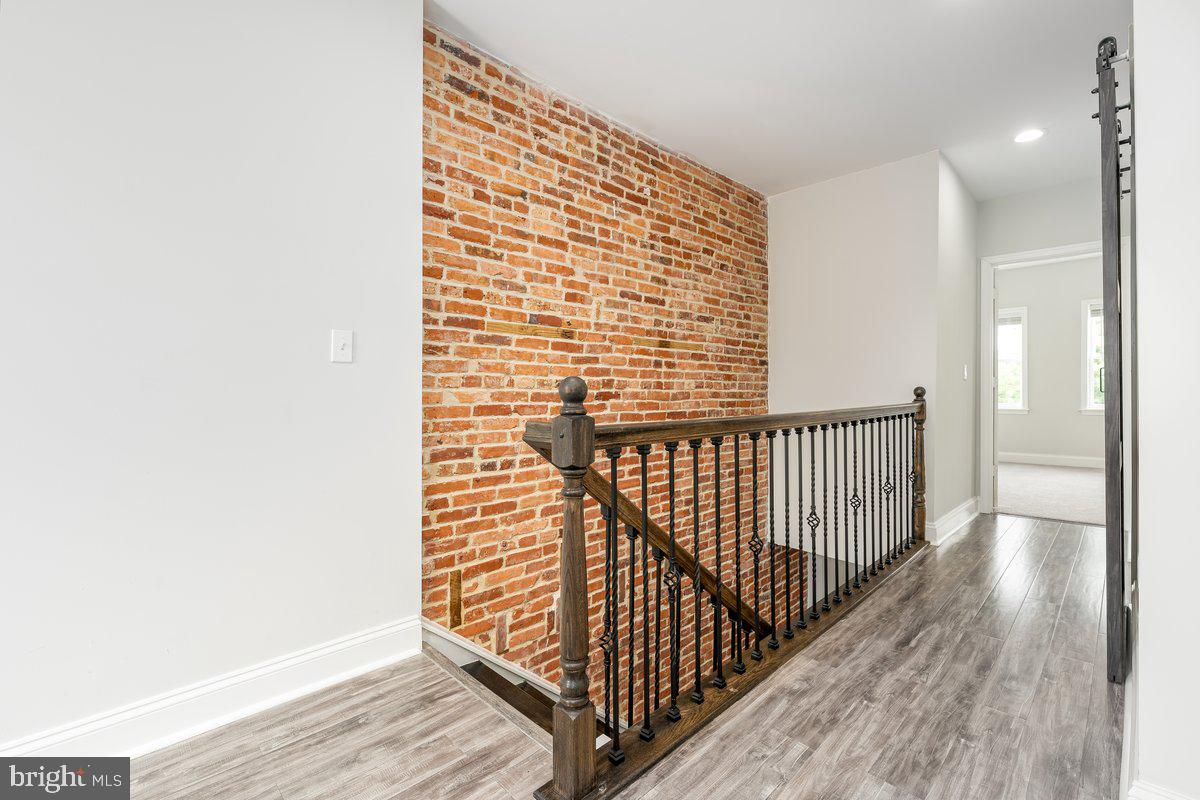 523 East 20th Street Baltimore, MD 21218 - Photo 18 of 28 a view of balcony with wooden floor