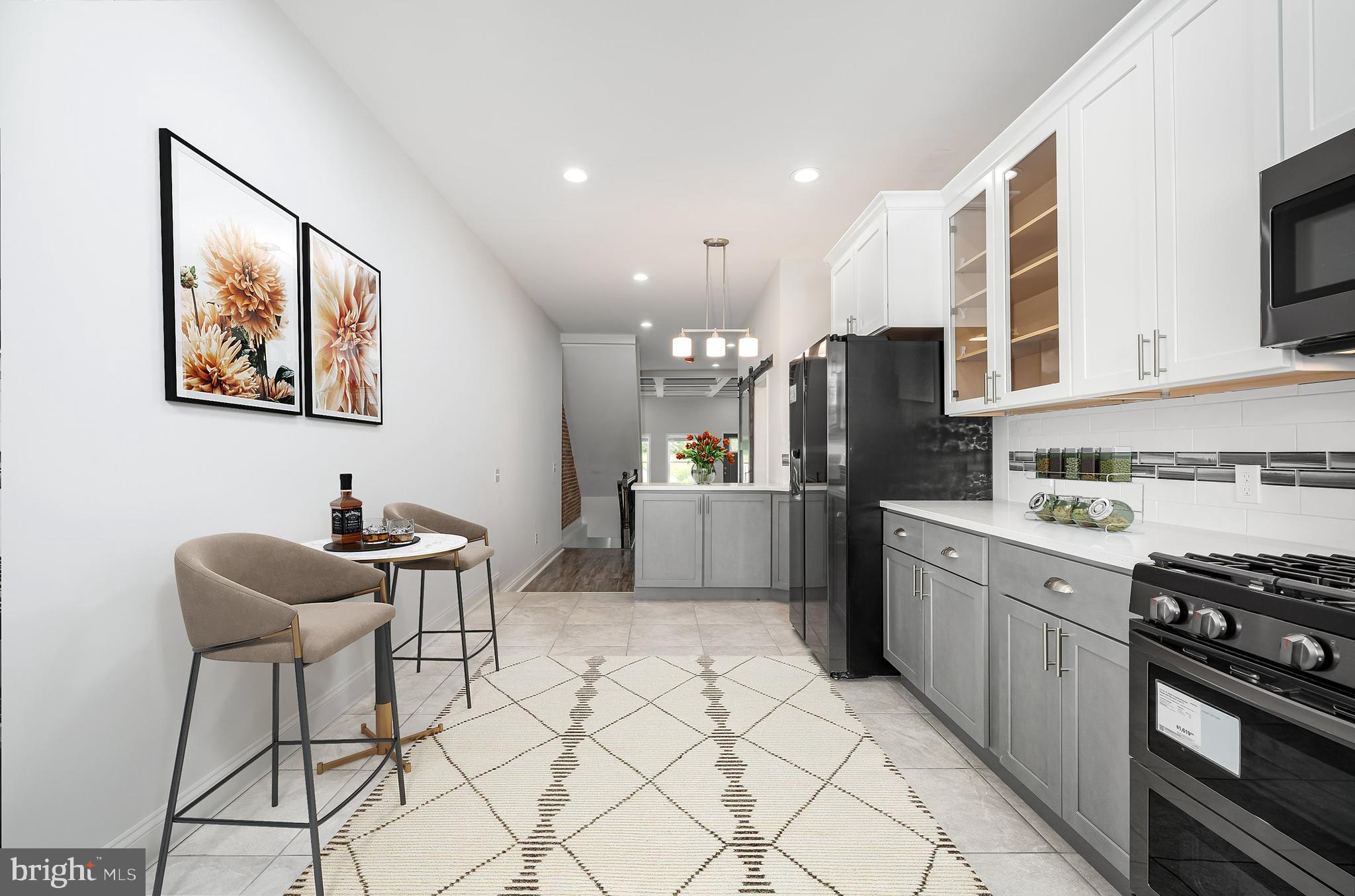523 East 20th Street Baltimore, MD 21218 - Photo 3 of 28 a kitchen with a cabinets and appliances