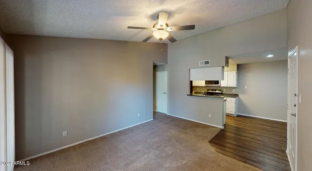 a view of kitchen with sink and wooden floor