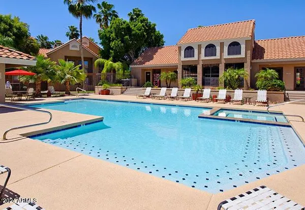 a view of a swimming pool with a patio