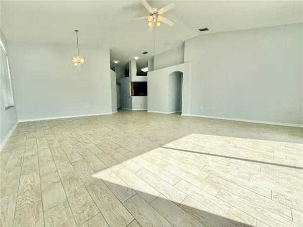 a view of a room with a wooden floor