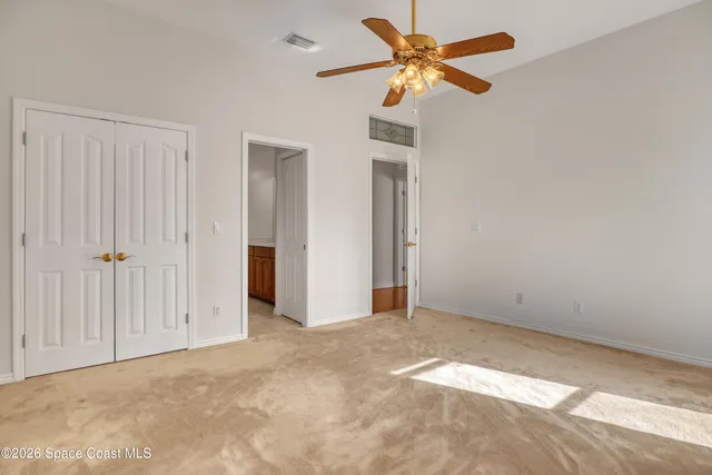 a view of an entryway with a floor to ceiling windows