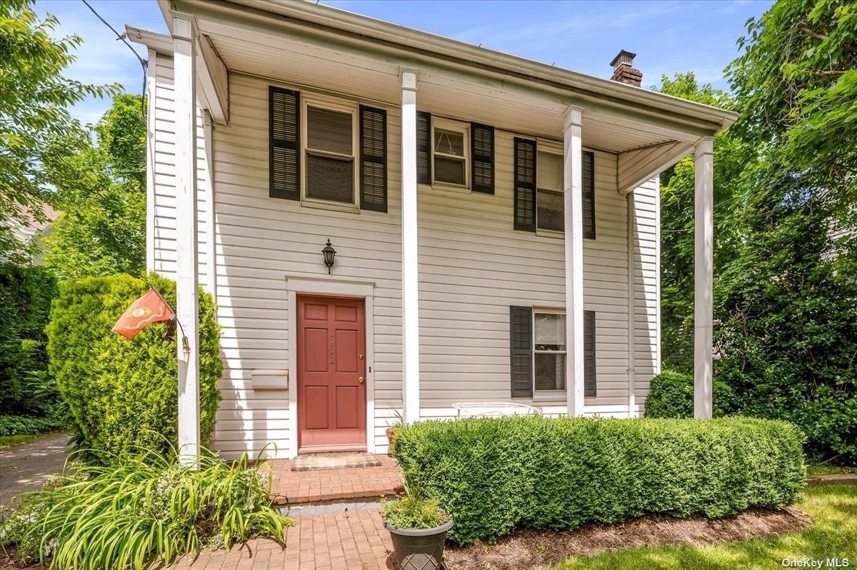 892 Middle Neck Road Great Neck, NY 11024 - Photo 1 of 1 a front view of a house with a yard