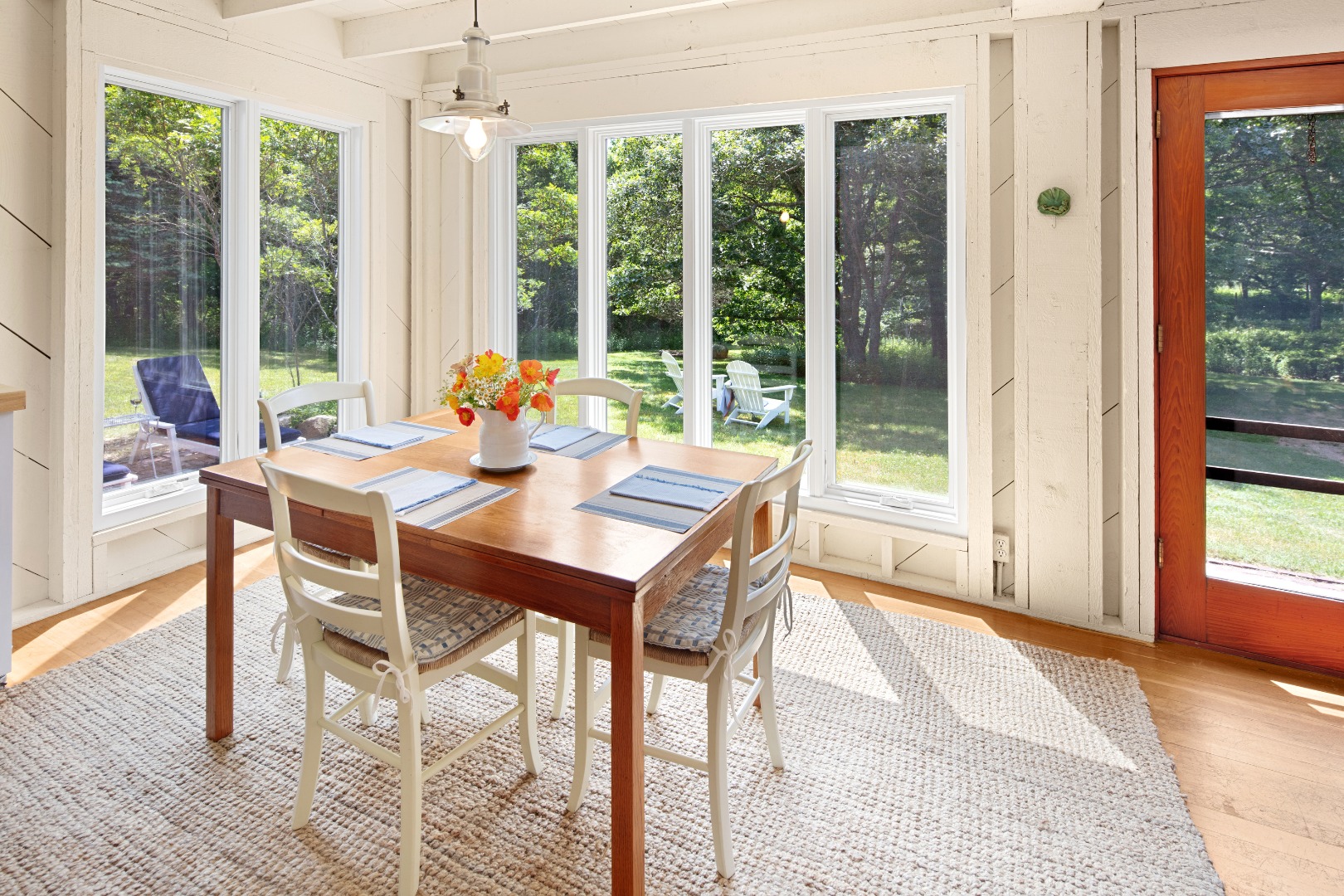 18 Allen Farm Road Chilmark, MA 02535 - Photo 3 of 13 a view of a dining room with furniture large windows and wooden floor