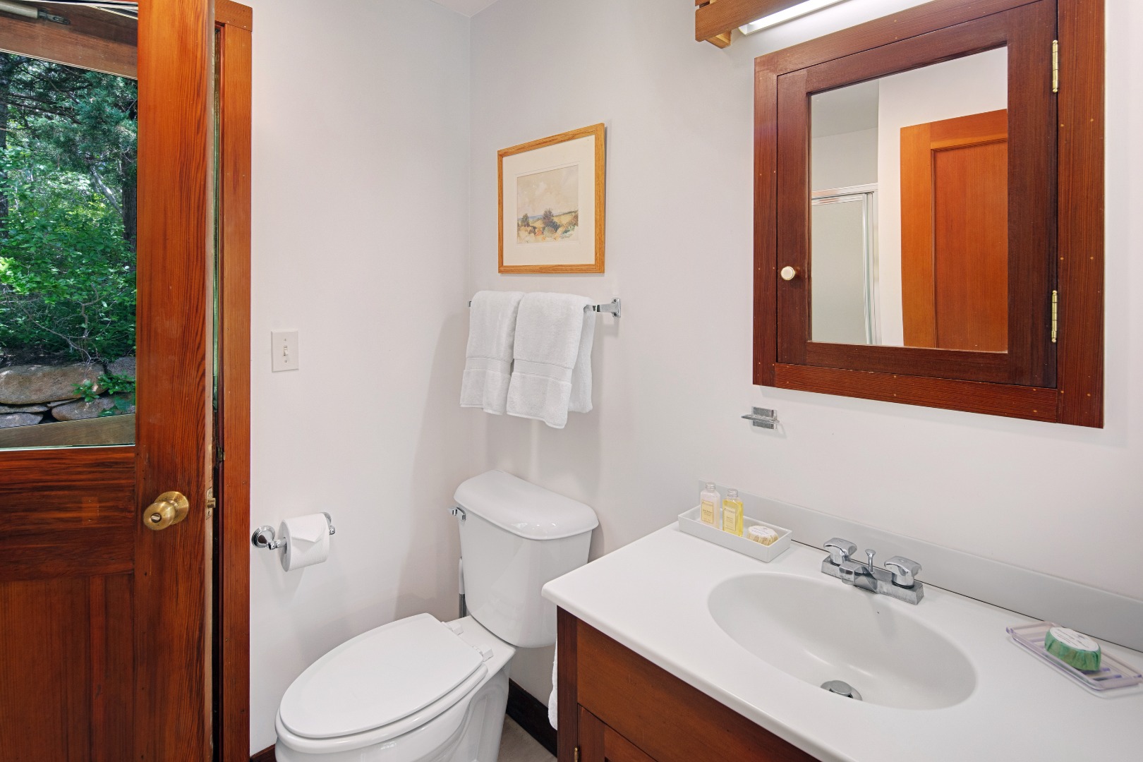 18 Allen Farm Road Chilmark, MA 02535 - Photo 9 of 13 a bathroom with a sink mirror and a toilet