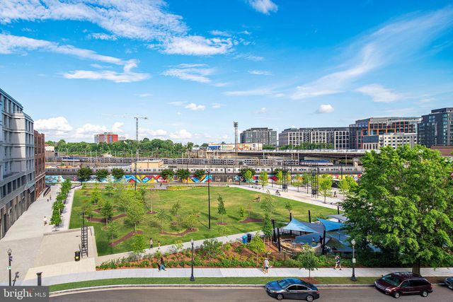 a view of a swimming pool and a back yard