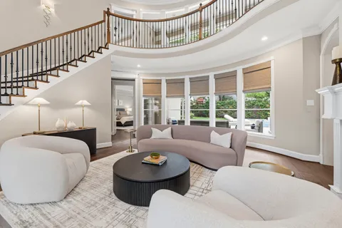 a living room with furniture and a table