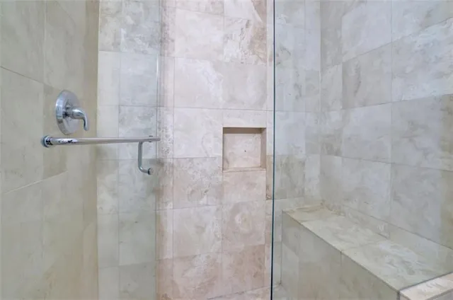 a kitchen with stainless steel appliances granite countertop a table chairs sink and cabinets