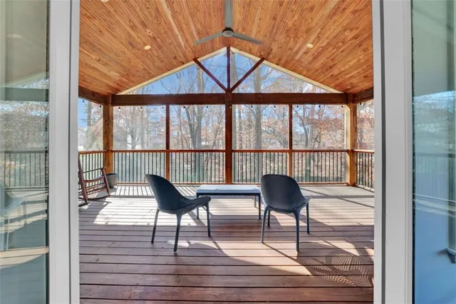 a view of a room with wooden floor and windows