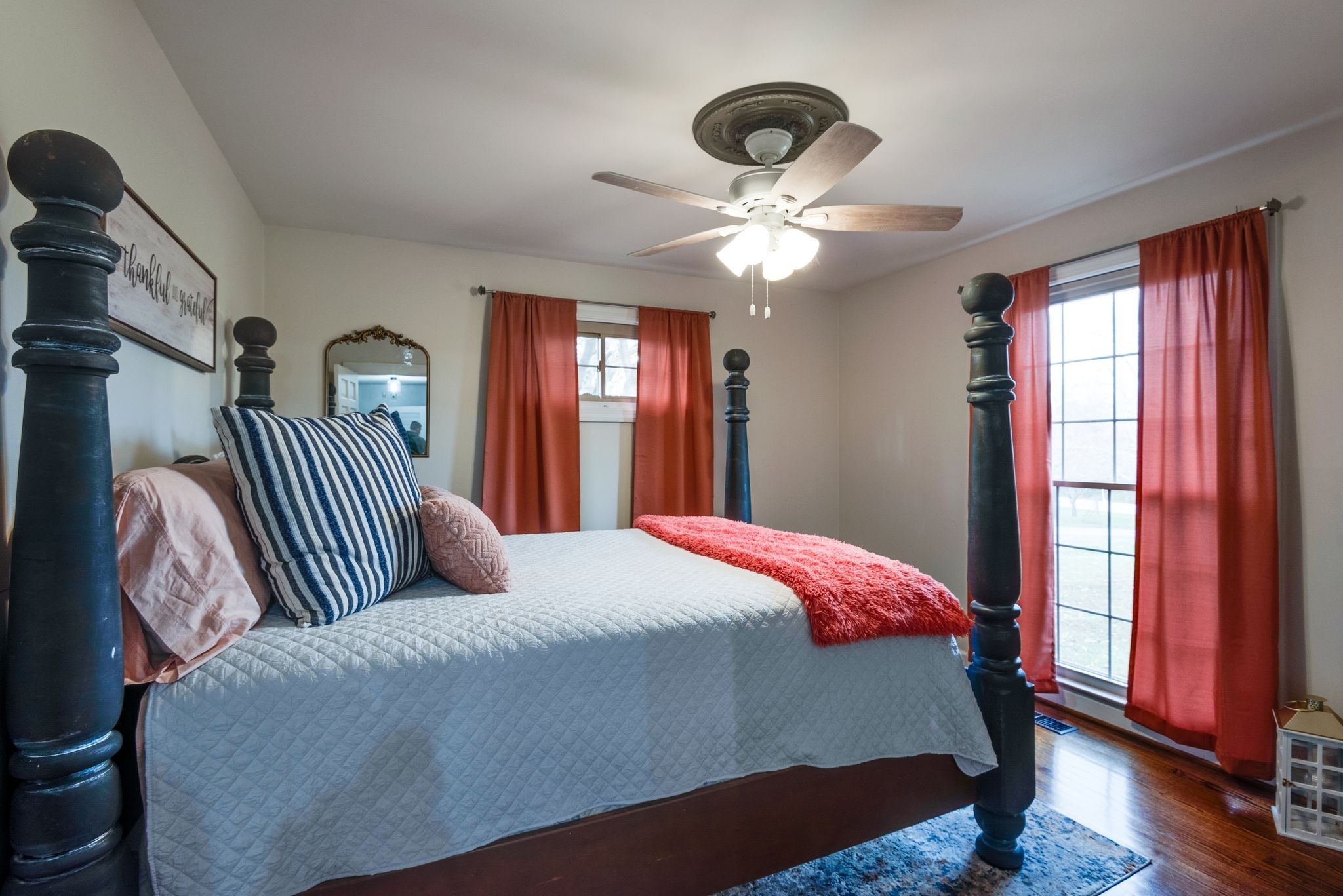 111 Proffitt Street Carthage, TN 37030 - Photo 12 of 38 a bedroom with a large bed and a chandelier