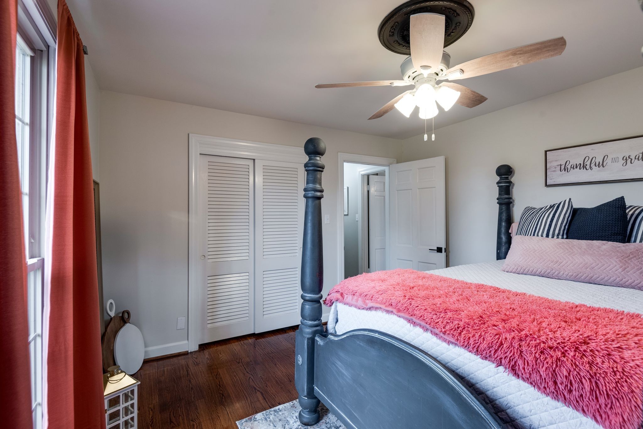 111 Proffitt Street Carthage, TN 37030 - Photo 13 of 38 a bedroom with a bed and a chandelier