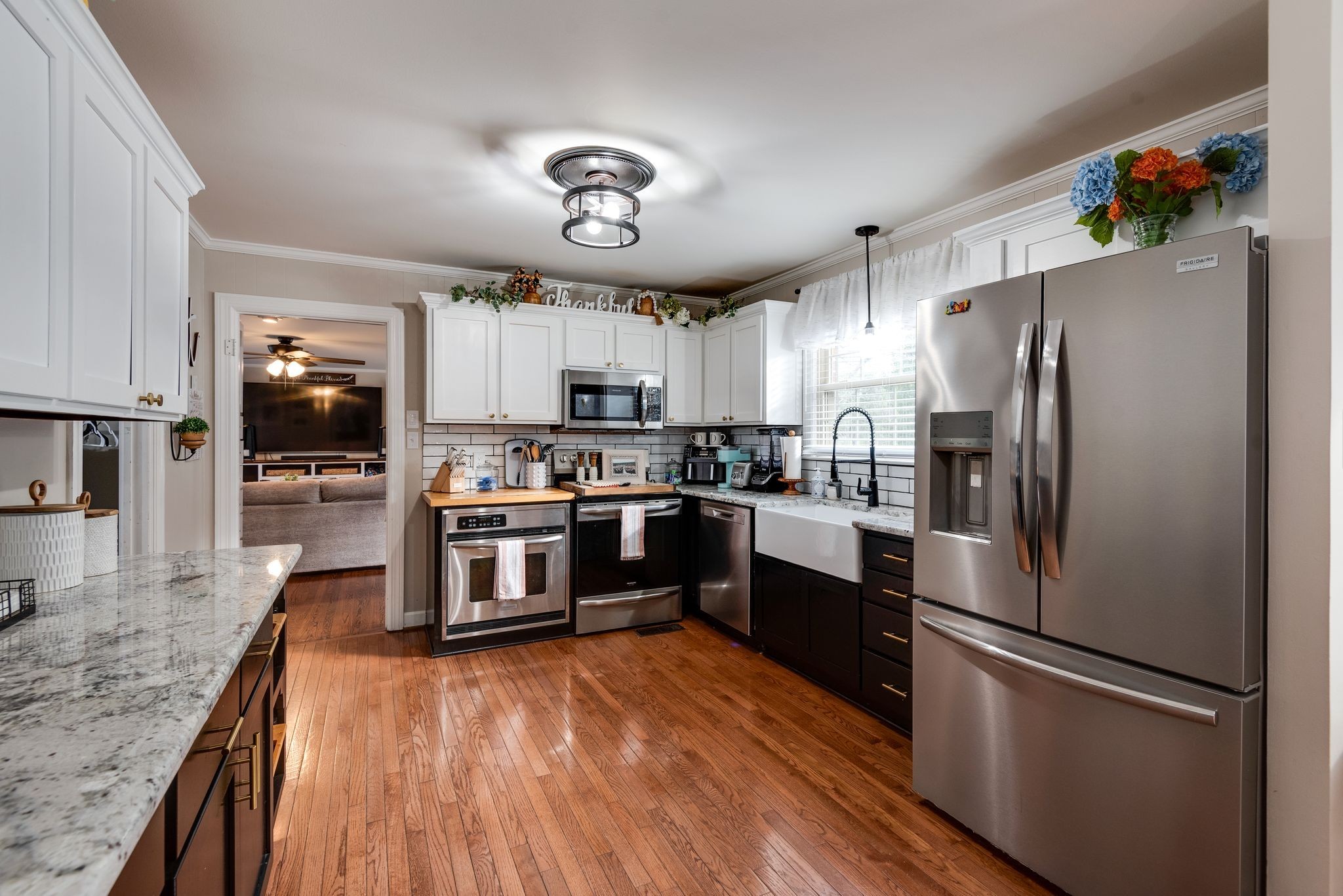 111 Proffitt Street Carthage, TN 37030 - Photo 22 of 38 a kitchen with granite countertop stainless steel appliances and wooden cabinets