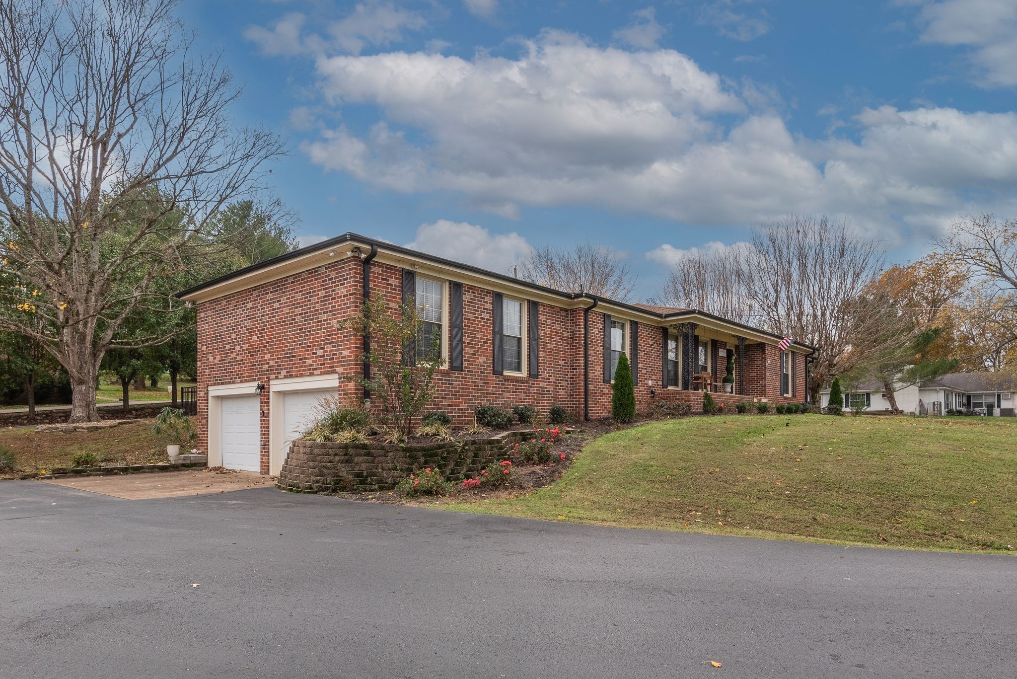 111 Proffitt Street Carthage, TN 37030 - Photo 5 of 38 a view of a house with a big yard plants and large trees