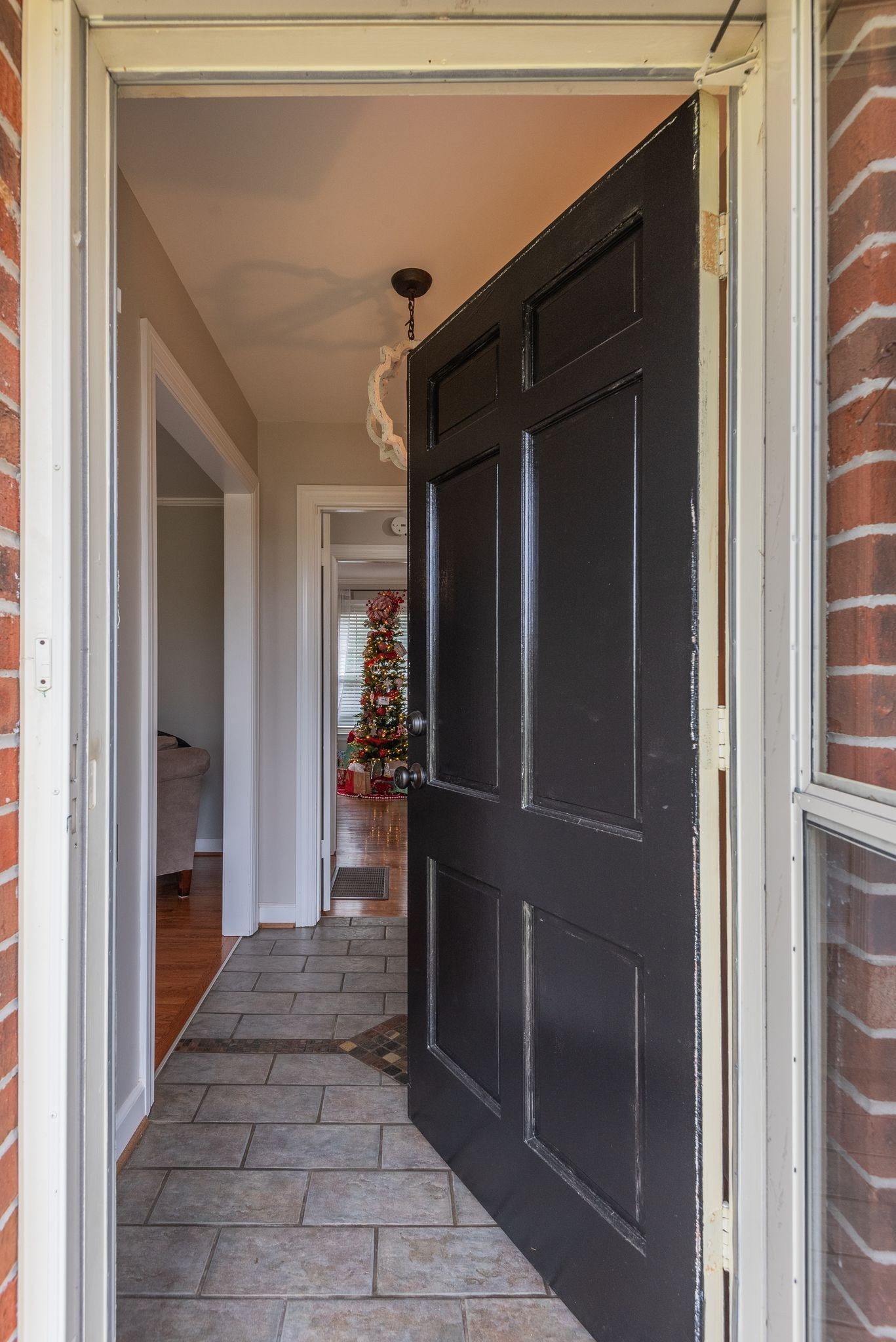 111 Proffitt Street Carthage, TN 37030 - Photo 6 of 38 a view of a hallway and a livingroom with wooden floor