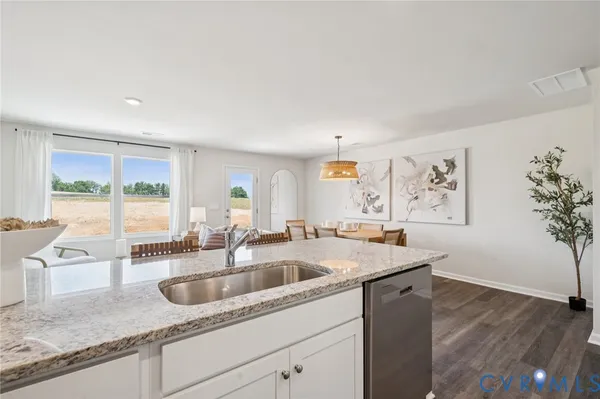 a kitchen with a sink and large window